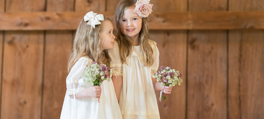 Heirloom flower girl dress ivory with lace inset and satin ribbons